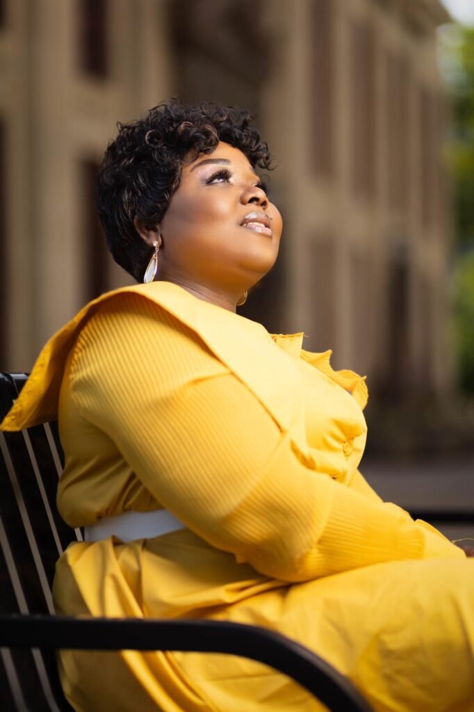 minister joana bedie looking up to the heavens